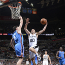 SAN ANTONIO, TX - MARCH 11: Manu Ginobili #20 of the San Antonio Spurs goes to the basket against Nick Collison #4 of the Oklahoma City Thunder on March 11, 2013 at the AT&T Center in San Antonio, Texas