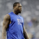 New York Giants defensive end Jason Pierre-Paul warms up before an NFL football game against the New Orleans Saints Sunday, Dec. 9, 2012, in East Rutherford, N.J. (AP Photo/Kathy Willens)