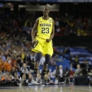 Michigan's Caris LeVert (23) reacts during the second half of the NCAA Final Four tournament college basketball semifinal game against Syracuse, Saturday, April 6, 2013, in Atlanta. Michigan won 61-56. (AP Photo/Charlie Neibergall)