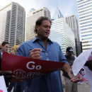 Former Philadelphia Phillies catcher Darren Daulton signs autographs during a rally for the baseball team at City Hall in Philadelphia, Monday, Oct. 26, 2009. The Phillies take on the New York Yankees in Game 1 of the World Series on Wednesday, in New York.(AP Photo/Matt Rourke)