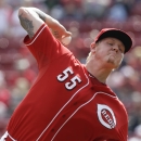 Cincinnati Reds starting pitcher Mat Latos throws against the New York Mets in the first inning of a baseball game, Wednesday, Sept. 25, 2013, in Cincinnati. (AP Photo/Al Behrman)