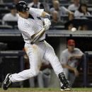 New York Yankees' Mark Teixeira hits a three-run home run during the eighth inning of a baseball game against the Los Angeles Angels, Friday, July 13, 2012, in New York.  (AP Photo/Frank Franklin II)