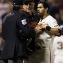 San Francisco Giants' Angel Pagan, right, is held back by manager Bruce Bochy, center, as he argues with home plate umpire Angel Hernandez after a strike out during the sixth inning of a baseball game against the Colorado Rockies on Tuesday, Sept. 18, 2012 in San Francisco. (AP Photo/Marcio Jose Sanchez)