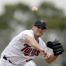 Minnesota Twins starting pitcher Kevin Correia throws to first on a pick-off attempt trying to catch Philadelphia Phillies' Pete Orr off base during the second inning of an exhibition spring training baseball game, Wednesday, Feb. 27, 2013, in Fort Myers, Fla. (AP Photo/David Goldman)