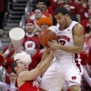 Ohio State's Aaron Craft (4) tips the ball away from Wisconsin's Traevon Jackson during the first half of an NCAA college basketball game on Sunday, Feb. 17, 2013, in Madison, Wis. (AP Photo/Andy Manis)