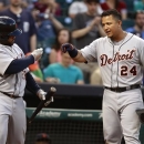 Detroit Tigers' Miguel Cabrera (24) is congratulated by Prince Fielder after Cabrera hit a home run during the sixth inning of a baseball game against the Houston Astros, Saturday, May 4, 2013, in Houston. (AP Photo/Patric Schneider)