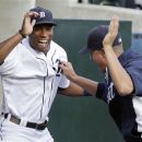Detroit Tigers' Austin Jackson, left, and Quintin Berry go through a pregame routine before a baseball game against the Los Angeles Angels, Friday, Aug. 24, 2012, in Detroit. (AP Photo/Duane Burleson)