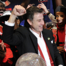 Louisville coach Rick Pitino celebrates at the the trophy ceremony after winning the NCAA Final Four tournament college basketball championship game against Michigan, Monday, April 8, 2013, in Atlanta.  Louisville won 82-76. (AP Photo/John Amis)