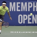 Kei Nishikori, of Japan, serves to Kevin Anderson, of South Africa, in the championship match of the Memphis Open tennis tournament Sunday, Feb. 15, 2015, in Memphis, Tenn. (AP Photo/Mark Humphrey)