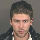 Colorado Avalanche goalie Semyon Varlamov appears in this booking photo released by the Denver Police Department. Varlamov surrendered to Denver police on an arrest warrant on charges of kidnapping and third-degree assault in what authorities are calling a domestic violence incident. Police released few details about the case Wednesday, Oct. 30, 2013, during a brief news conference. (AP Photo/Denver Police Department)