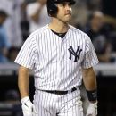 New York Yankees' Mark Teixeira watches his two-run home run off Boston Red Sox pitcher Vicente Padilla during the eighth inning of the baseball game at Yankee Stadium in New York, Saturday, July 28, 2012. The Red Sox won 8-6. (AP Photo/Seth Wenig)