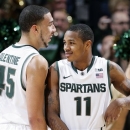 Michigan State's Keith Appling (11) and Denzel Valentine celebrate during the second half of an NCAA college basketball game against Wisconsin, Thursday, March 7, 2013, in East Lansing, Mich. Appling led Michigan State with 19 points in a 58-43 win. (AP Photo/Al Goldis)