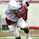 FILE - In this April 13, 2012 file photo, Arkansas running back Knile Davis goes through drills during NCAA college football spring practice in Fayetteville, Ark. The Arkansas running back missed all of last season with an ankle injury, and his return to form could very well hold the key to the Razorbacks championship hopes this season. (AP Photo/April L. Brown, File)