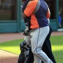 Detroit Tigers catcher Alex Avila, left, is helped off the field after colliding with first baseman Prince Fielder in the sixth inning of a baseball game against the Cleveland Indians, Sunday, Sept. 16, 2012, in Cleveland. (AP Photo/Tony Dejak)