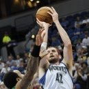 Minnesota Timberwolves' Kevin Love, right, gove up for a shot as Maccabi Haifa's James Thomas defends in the first half of an NBA exhibition basketball game against the Israeli team, Tuesday, Oct. 16, 2012 , in Minneapolis. Love led the Timberwolves with 24 points in their 114-81 win. (AP Photo/Jim Mone)
