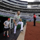 Washington Nationals left fielder Bryce Harper, left, and second baseman Danny Espinosa walk out of the clubhouse to throw before an interleague baseball game against the Detroit Tigers was rained out, at Nationals Park Tuesday, May 7, 2013, in Washington. They have rescheduled the game for Thursday May 9 at 4:05 pm. (AP Photo/Alex Brandon)