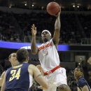 Syracuse forward C.J. Fair (5) takes a shot over California forward Robert Thurman (34) during the first half of a third-round game in the NCAA college basketball tournament Saturday, March 23, 2013, in San Jose, Calif. (AP Photo/Tony Avelar)