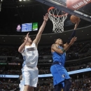 Dallas Mavericks forward Shawn Marion, right, goes up for a shot as Denver Nuggets forward Danilo Gallinari, of Italy, covers in the first quarter of an NBA basketball game in Denver on Thursday, April 4, 2013. (AP Photo/David Zalubowski)