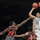 Georgetown's Otto Porter Jr. (22) shoots over Cincinnati's Sean Kilpatrick (23) and JaQuon Parker during the first half of an NCAA college basketball game at the Big East Conference tournament, Thursday, March 14, 2013 in New York. (AP Photo/Mary Altaffer)