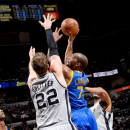 SAN ANTONIO, TX - MAY 8: Carl Landry #7 of the Golden State Warriors shoots in the lane against Tiago Splitter #22 of the San Antonio Spurs in Game Two of the Western Conference Semifinals during the 2013 NBA Playoffs on May 8, 2013 at the AT&T Center in San Antonio, Texas