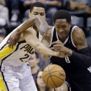 Brooklyn Nets guard MarShon Brooks , right is fouled by Indiana Pacers forward Gerald Green after making a steal in the first half of an NBA basketball game in Indianapolis, Monday, Feb. 11, 2013. (AP Photo/Michael Conroy)