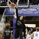 Baylor center Brittney Griner (42) dunks as Destiny Williams (10), TCU's Veja Hamilton, center, and Kamy Cole (11) watch in the first half of an NCAA college basketball game, Wednesday, Jan. 2, 2013, in Fort Worth, Texas. (AP Photo/Tony Gutierrez)