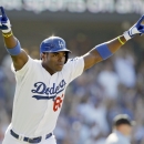 Los Angeles Dodgers' Yasiel Puig takes off on his solo home run that gave the Dodgers a 1-0 win over the Cincinnati Reds in the 11th inning of a baseball game in Los Angeles, Sunday, July 28, 2013. (AP Photo/Reed Saxon)