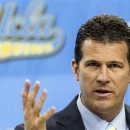 FILE - In this April 2, 2013 file photo, Steve Alford, UCLA's new men's basketball coach, gestures during a news conference at the Pauley Pavilion in Los Angeles. A University of New Mexico official says former Lobos basketball coach Alford is willing to pay a $200,000 buyout for leaving the Albuquerque school to take a job at UCLA but he won't pay the $1 million payment that New Mexico wants. (AP Photo/Damian Dovarganes, File)