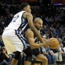 Memphis Grizzlies forward Rudy Gay (22) fouls San Antonio Spurs guard Tony Parker, of France, in the first half of an NBA basketball game on Friday, Jan. 11, 2013, in Memphis, Tenn. (AP Photo/Lance Murphey)
