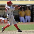 Los Angeles Angels' Alberto Callaspo drives in two runs with a double against the Oakland Athletics during the 11th inning of a baseball game Wednesday, May 23, 2012, in Oakland, Calif. Los Angeles won 3-1. (AP Photo/Marcio Jose Sanchez)