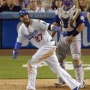 Los Angeles Dodgers' Matt Kemp and Colorado Rockies catcher Wilin Rosario watch Kemp's solo home run during the fourth inning of a baseball game, Saturday, Sept. 29, 2012, in Los Angeles. (AP Photo/Mark J. Terrill)