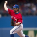 Toronto Blue Jays starting pitcher R.A. Dickey pitches during the first inning of a baseball game against the Detroit Tigers in Toronto, on Monday July 1, 2013. (AP Photo/The Canadian Press, Frank Gunn)