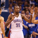OKLAHOMA CITY, OK - APRIL 21: Kevin Durant #35 of the Oklahoma City Thunder high fives Kevin Martin #23 and Derek Fisher #6 after scoring against the Houston Rockets during the second half of Game One of the Western Conference Quarterfinals of the 2013 NBA Playoffs against the Houston Rockets at Chesapeake Energy Arena on April 21, 2013 in Oklahoma City, Oklahoma. The Thunder defeated the Rockets 120-91. (Photo by Christian Petersen/Getty Images)