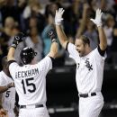 Chicago White Sox's Jordan Danks, right, celebrates his game-winning home run off Oakland Athletics relief pitcher Pat Neshek with Gordon Beckham during the ninth inning of a baseball game Friday, Aug. 10, 2012, in Chicago. Chicago won 4-3. (AP Photo/Charles Rex Arbogast)