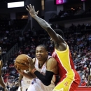 Oklahoma City Thunder's Russell Westbrook, left, tries to get past Houston Rockets' Patrick Beverley in the first half of an NBA basketball game, Wednesday, Feb. 20, 2013, in Houston. (AP Photo/Pat Sullivan)
