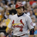 St. Louis Cardinals' Yadier Molina walks back to the dugout after striking out to end the fourth inning during a baseball game against the Pittsburgh Pirates in Pittsburgh Monday, July 29, 2013. (AP Photo/Gene J. Puskar)