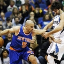 New York Knicks' Jason Kidd, left, pushes Minnesota Timberwolves' Ricky Rubio of Spain out of the way as he drives in the first period of an NBA basketball game Friday, Feb. 8, 2013 in Minneapolis. (AP Photo/Jim Mone)