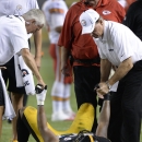 Pittsburgh Steelers linebacker Jarvis Jones (95) is looked assisted by trainers after being injured in the fourth quarter of an NFL preseason football game against the Kansas City Chiefs on Saturday, Aug. 24, 2013, in Pittsburgh. (AP Photo/Don Wright)