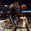 Virginia's Akil Mitchell, right, and teammate Jontel Evans, left, battle for possession against St. John's Chris Obekpa during an NIT college basketball game in Charlottesville, Va., Sunday, March 24, 2013. (AP Photo/Pat Jarrett)