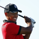 Tiger Woods reacts to his tee shot on the 17th hole during the final round of The Barclays golf tournament on Sunday, Aug. 25, 2013, in Jersey City, N.J. Woods finished in a four-way tie for second place. (AP Photo/Rich Schultz)