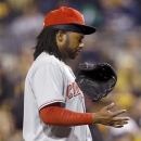 Cincinnati Reds starting pitcher Johnny Cueto tosses his glove as he leaves the game after apparently injuring his arm throwing to Pittsburgh Pirates' Pedro Alvarez in the fifth inning of the baseball game on Saturday, April 13, 2013, in Pittsburgh. (AP Photo/Keith Srakocic)