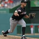 Miami Marlins relief pitcher Steve Cishek (31) throws during the eighth inning of a baseball game with the Washington Nationals Sunday, Aug. 5, 2012, in Washington. The Nationals won 4-1. (AP Photo/Alex Brandon)