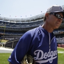 Los Angeles Dodgers manager Don Mattingly walks on the field before a baseball game against the New York Yankees Wednesday, June 19, 2013, in New York. (AP Photo/Kathy Willens)
