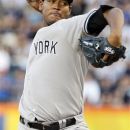 New York Yankees' Ivan Nova delivers a pitch during the first inning of an interleague baseball game against the New York Mets, Saturday, June 23, 2012, in New York. (AP Photo/Frank Franklin II)