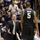 Michigan State coach Tom Izzo, left, questions center Adreian Payne as he comes off the court in the first half of an NCAA college basketball game against Purdue in West Lafayette, Ind., Saturday, Feb. 9, 2013. (AP Photo/Michael Conroy)