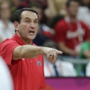 USA coach Mike Krzyzewski calls in to his players during a men's basketball game against Lithuania at the 2012 Summer Olympics, Saturday, Aug. 4, 2012, in London. (AP Photo/Charles Krupa)