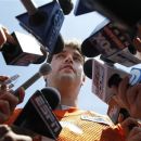 Chicago Bears quarterback Jay Cutler talks with reporters after an NFL organized team activity, Wednesday, May 23 2012, in Lake Forest, Ill. (AP Photo/Charles Rex Arbogast)