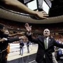FILE - In this March 24, 2013, file photo, Miami head coach Jim Larranaga celebrates with fans after their 63-59 win over Illinois in a third-round game of the NCAA college basketball tournament in Austin, Texas. (AP Photo/Eric Gay, File)