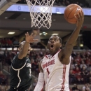 FILE - In this Feb. 24, 2013, file photo, Ohio State's Deshaun Thomas, right, shoots against Michigan State during an NCAA college basketball game in Columbus, Ohio. Thomas will forego his final season of eligibility at Ohio State and will enter the NBA draft. (AP Photo/Jay LaPrete, File0