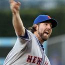 The New York Mets starter R.A. Dickey pitches to the Los Angeles Dodgers in the first inning of a baseball game at Dodger Stadium in Los Angeles, Friday, June 29, 2012. (AP Photo/Reed Saxon)